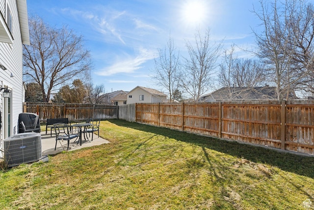 view of yard featuring a patio, a fenced backyard, and central air condition unit