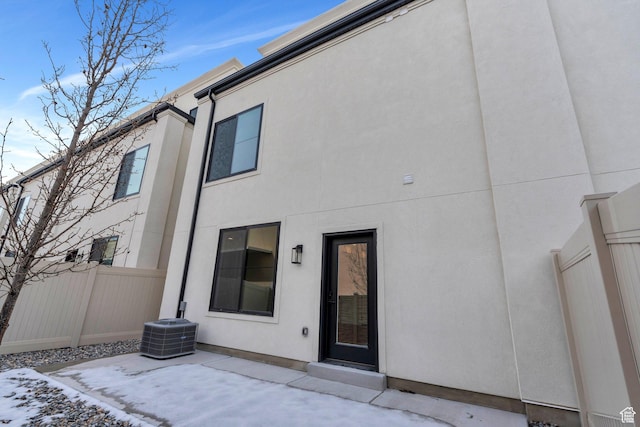 5328 W Dosh Ln Unit 40, Highland, UT 84003 - back of house with stucco siding, fence, central AC, and a patio