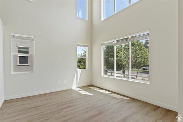 818 W 1100 N Unit 140, North Salt Lake, UT 84054 - empty room with wood finished floors and a towering ceiling