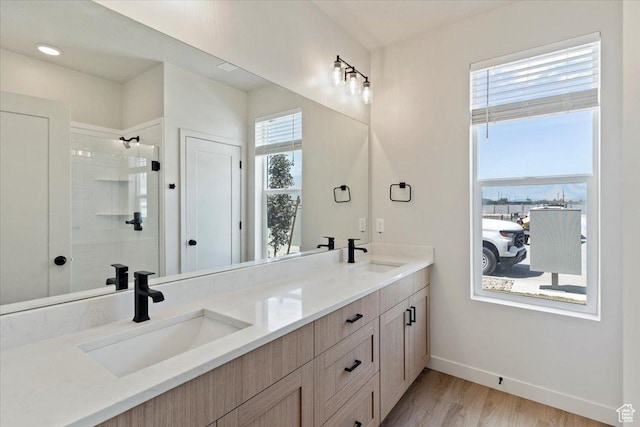 818 W 1100 N Unit 140, North Salt Lake, UT 84054 - full bathroom featuring double vanity, wood finished floors, and a tile shower