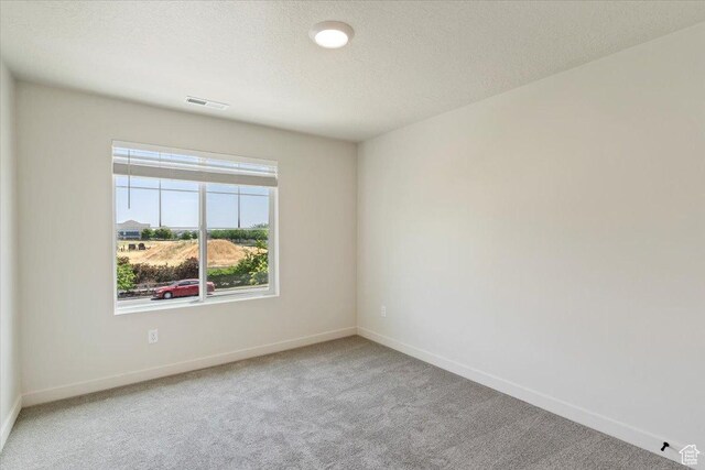 818 W 1100 N Unit 140, North Salt Lake, UT 84054 - carpeted empty room featuring baseboards and a textured ceiling