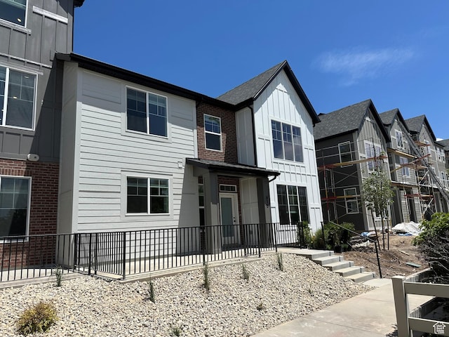 818 W 1100 N Unit 140, North Salt Lake, UT 84054 - view of front of home featuring board and batten siding and brick siding