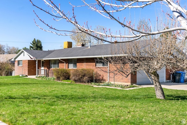 2047 N 1350 E, North Logan, UT 84341 - ranch-style home with brick siding, a front yard, and concrete driveway
