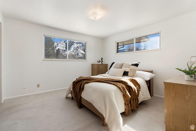 2047 N 1350 E, North Logan, UT 84341 - bedroom with light carpet, multiple windows, and baseboards