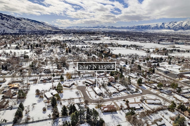 2047 N 1350 E, North Logan, UT 84341 - snowy aerial view with a mountain view and a residential view