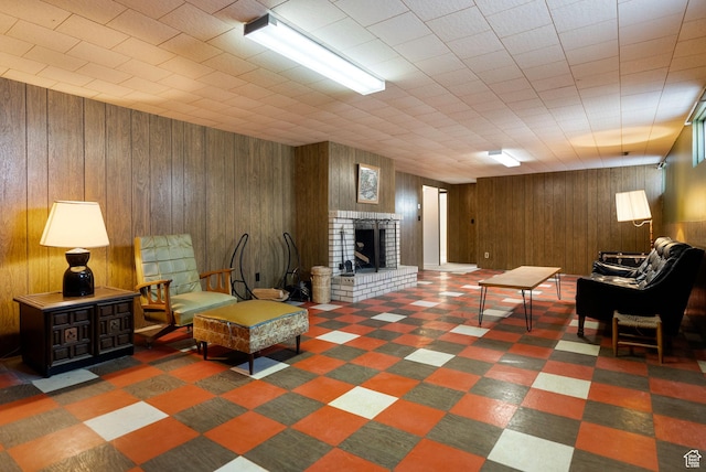 2047 N 1350 E, North Logan, UT 84341 - living room featuring wooden walls, tile patterned floors, and a brick fireplace