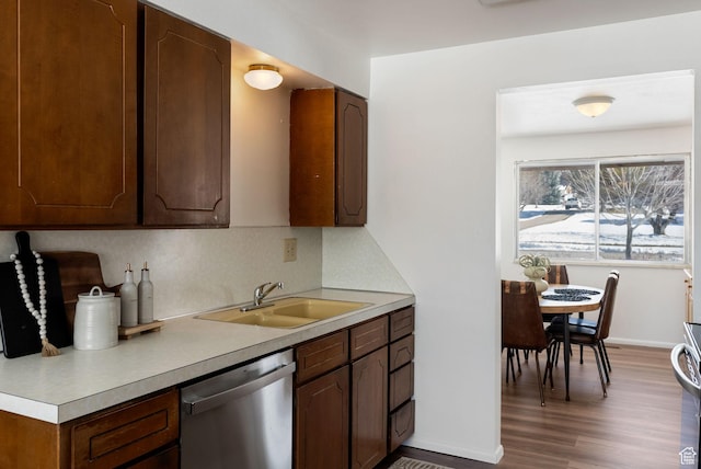 2047 N 1350 E, North Logan, UT 84341 - kitchen with stainless steel dishwasher, a sink, light wood-type flooring, and light countertops