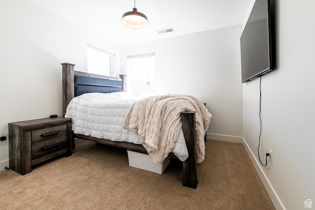 695 W Claystone Dr, St George, UT 84790 - bedroom featuring baseboards, visible vents, and light colored carpet