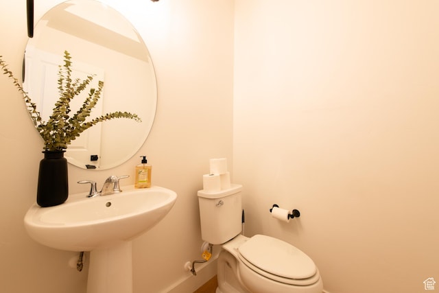 695 W Claystone Dr, St George, UT 84790 - bathroom with a sink, toilet, and baseboards