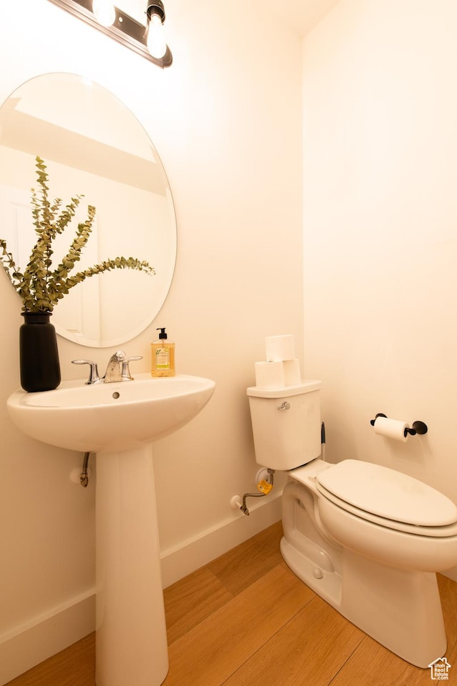 695 W Claystone Dr, St George, UT 84790 - bathroom featuring baseboards, a sink, toilet, and wood finished floors