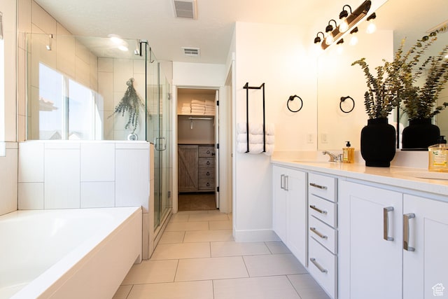 695 W Claystone Dr, St George, UT 84790 - bathroom with a bath, double vanity, a shower stall, and visible vents