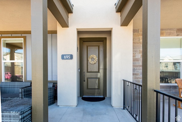695 W Claystone Dr, St George, UT 84790 - doorway to property featuring stucco siding
