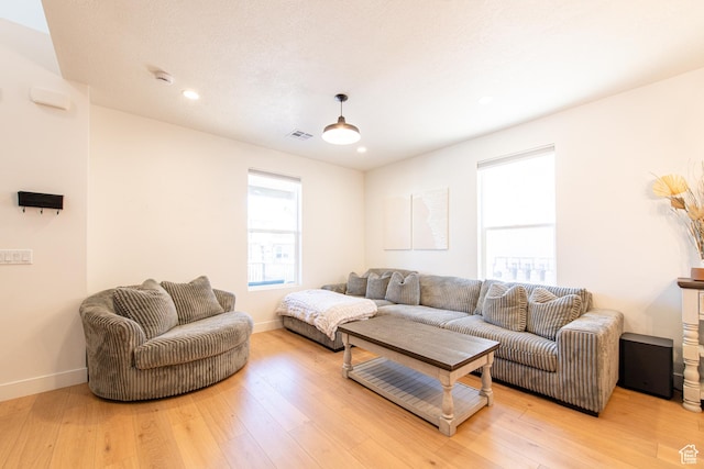 695 W Claystone Dr, St George, UT 84790 - living area with light wood-type flooring, visible vents, and baseboards