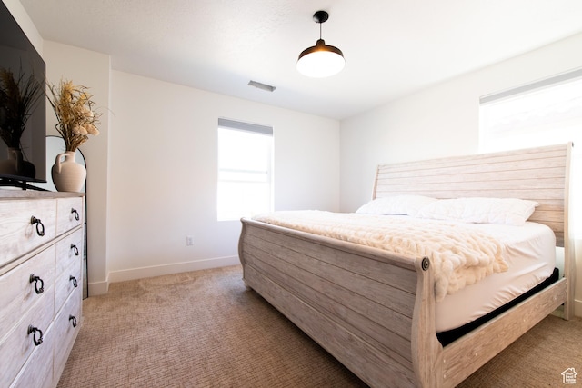 695 W Claystone Dr, St George, UT 84790 - bedroom with light carpet, visible vents, and baseboards