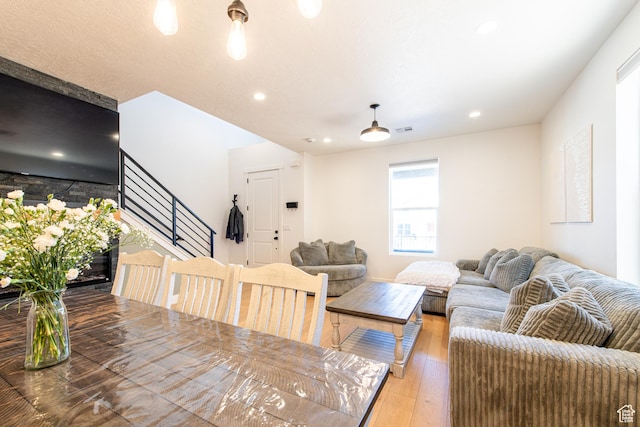 695 W Claystone Dr, St George, UT 84790 - living room with stairs, wood finished floors, and recessed lighting