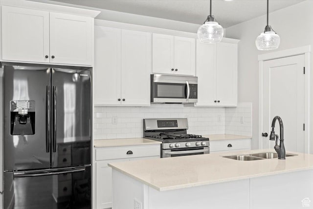 5927 W Lake Ave S, South Jordan, UT 84009 - kitchen featuring white cabinets, decorative backsplash, stainless steel appliances, and a sink
