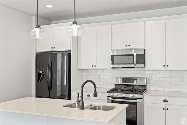 5927 W Lake Ave S, South Jordan, UT 84009 - kitchen with stainless steel appliances, backsplash, a sink, and white cabinets