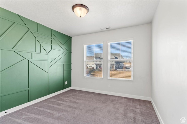 5927 W Lake Ave S, South Jordan, UT 84009 - carpeted spare room featuring visible vents, a textured ceiling, and baseboards
