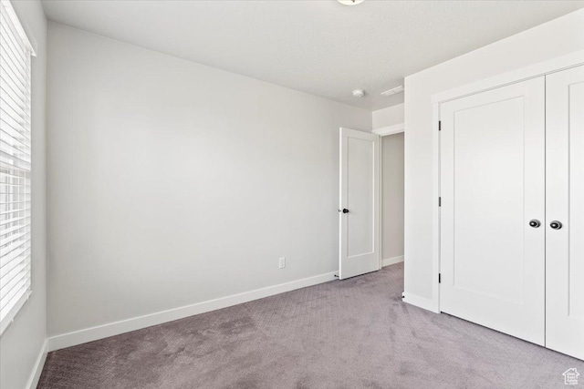 5927 W Lake Ave S, South Jordan, UT 84009 - unfurnished bedroom with carpet, baseboards, and a closet