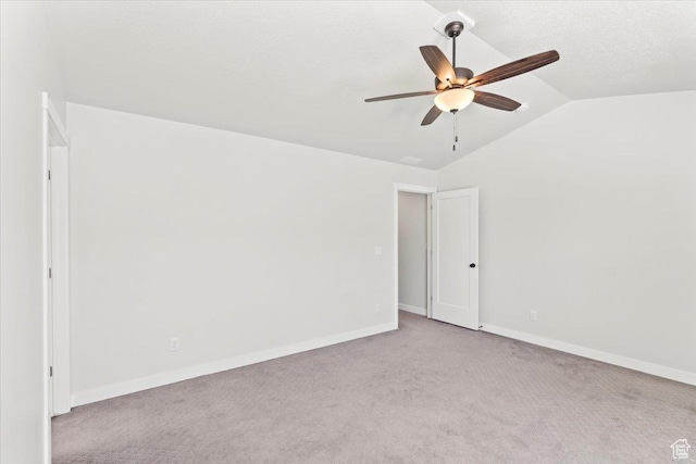 5927 W Lake Ave S, South Jordan, UT 84009 - spare room featuring light carpet, baseboards, lofted ceiling, ceiling fan, and a textured ceiling