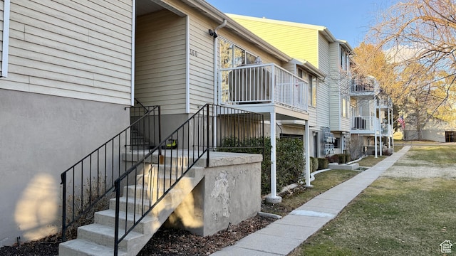 view of side of home featuring stairway