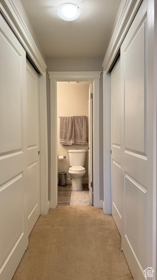 corridor with carpet floors
