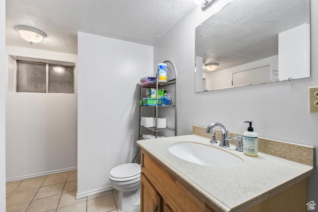 2490 W 12195 S, Riverton, UT 84065 - bathroom with a textured ceiling, toilet, tile patterned floors, vanity, and baseboards