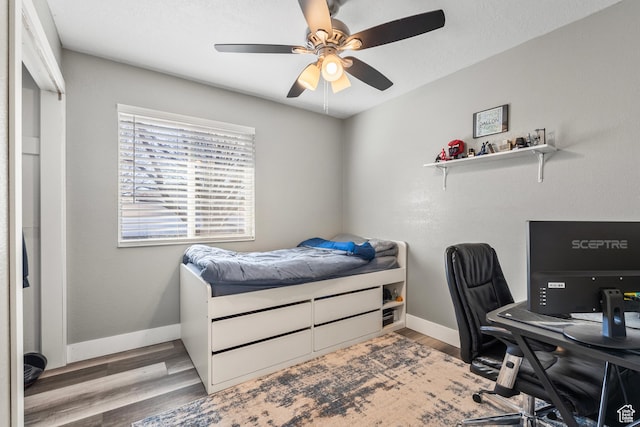 2490 W 12195 S, Riverton, UT 84065 - bedroom featuring a desk, wood finished floors, baseboards, and a ceiling fan