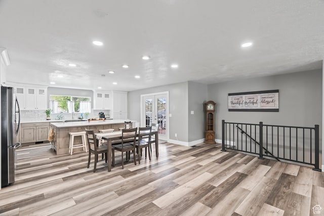 2490 W 12195 S, Riverton, UT 84065 - dining space with recessed lighting, light wood-type flooring, french doors, and baseboards