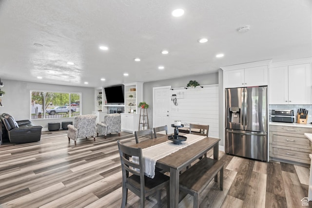 2490 W 12195 S, Riverton, UT 84065 - dining area with recessed lighting, wood finished floors, and a textured ceiling