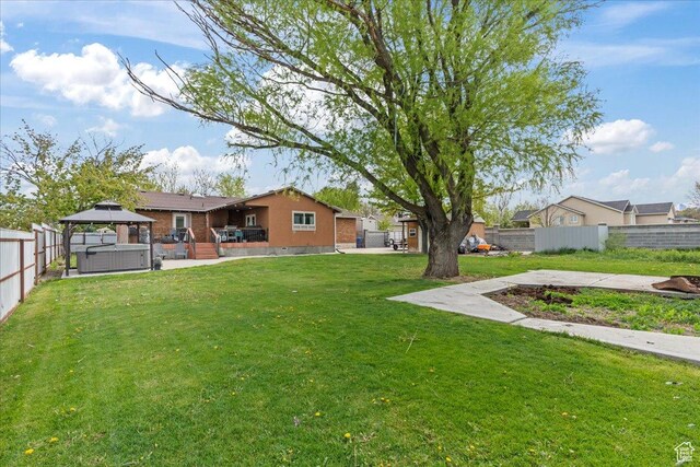 2490 W 12195 S, Riverton, UT 84065 - view of yard with a gazebo, a hot tub, and a patio area