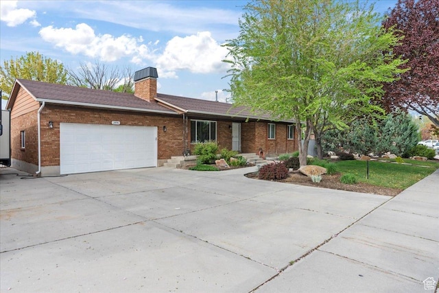 2490 W 12195 S, Riverton, UT 84065 - single story home with brick siding, a garage, concrete driveway, and a chimney