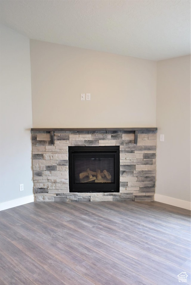 154 S Liberty St Unit 204, Grantsville, UT 84029 - room details with a fireplace, baseboards, and wood finished floors
