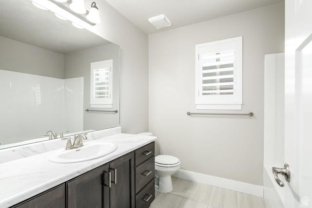 154 S Liberty St Unit 204, Grantsville, UT 84029 - bathroom with baseboards, toilet, and vanity