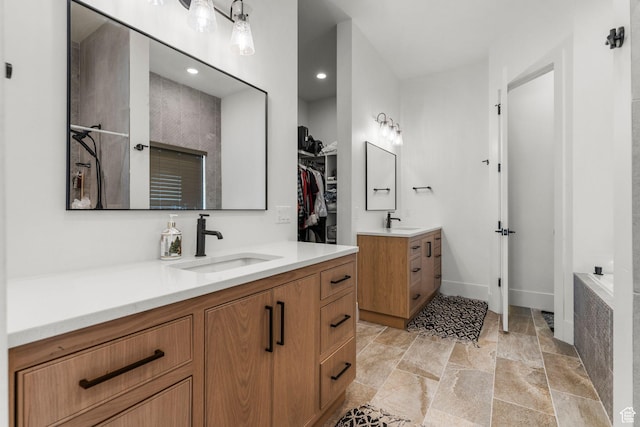 501 W 2300 S, Richfield, UT 84701 - bathroom with a walk in closet, stone finish flooring, two vanities, and a sink