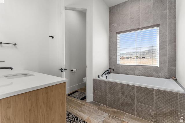 501 W 2300 S, Richfield, UT 84701 - bathroom featuring vanity, toilet, and a bath