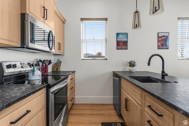 501 W 2300 S, Richfield, UT 84701 - kitchen with light brown cabinets, appliances with stainless steel finishes, wood finished floors, and a sink