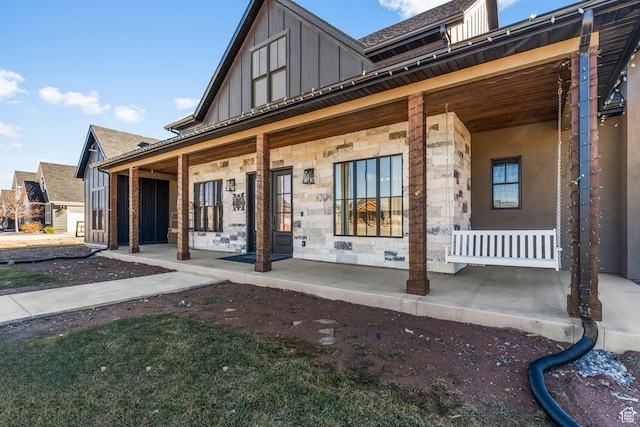 501 W 2300 S, Richfield, UT 84701 - exterior space featuring board and batten siding, stone siding, covered porch, and roof with shingles