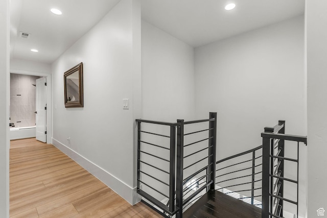 501 W 2300 S, Richfield, UT 84701 - corridor featuring recessed lighting, wood finished floors, visible vents, an upstairs landing, and baseboards