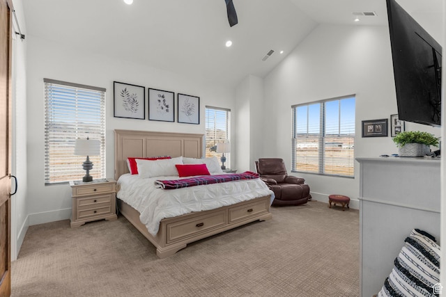 501 W 2300 S, Richfield, UT 84701 - bedroom featuring light carpet, baseboards, multiple windows, and high vaulted ceiling