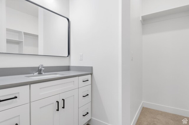 271 N 1160 N Unit 32, Tooele, UT 84074 - bathroom with vanity and baseboards