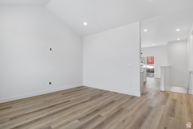 271 N 1160 N Unit 32, Tooele, UT 84074 - spare room featuring light wood-type flooring, lofted ceiling, and recessed lighting