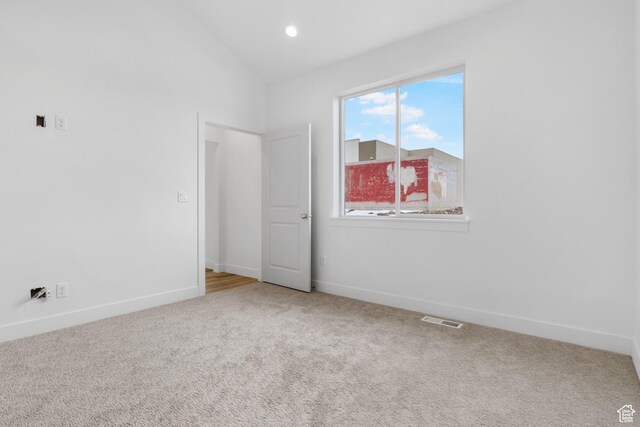 271 N 1160 N Unit 32, Tooele, UT 84074 - carpeted empty room featuring lofted ceiling, baseboards, visible vents, and recessed lighting