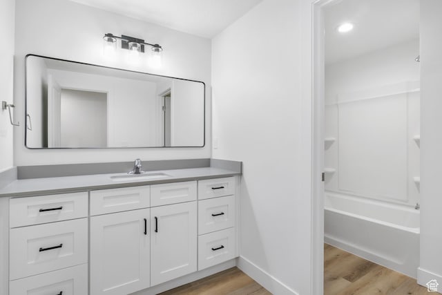 271 N 1160 N Unit 32, Tooele, UT 84074 - full bath with bathtub / shower combination, wood finished floors, vanity, and baseboards