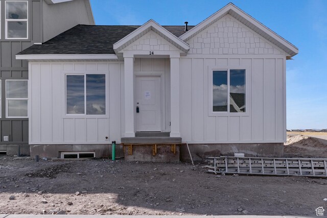 271 N 1160 N Unit 32, Tooele, UT 84074 - view of front facade featuring a shingled roof and board and batten siding