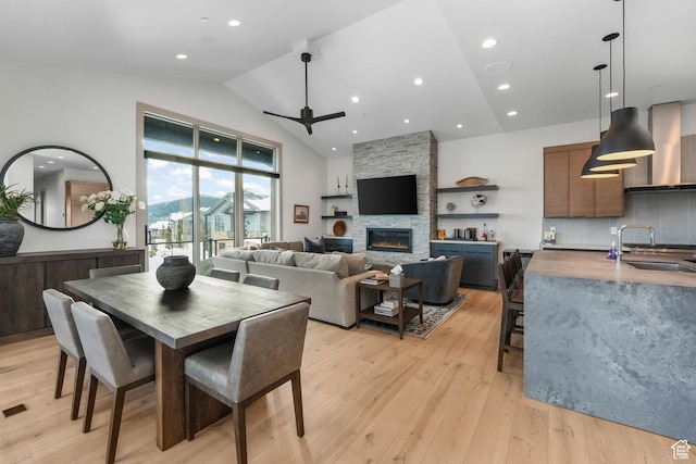 4371 Frost Haven Rd, Park City, UT 84098 - dining room featuring ceiling fan, high vaulted ceiling, recessed lighting, a fireplace, and light wood-style floors