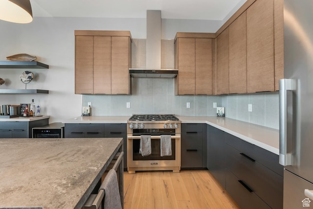 4371 Frost Haven Rd, Park City, UT 84098 - kitchen featuring appliances with stainless steel finishes, light wood-style floors, wall chimney range hood, and tasteful backsplash