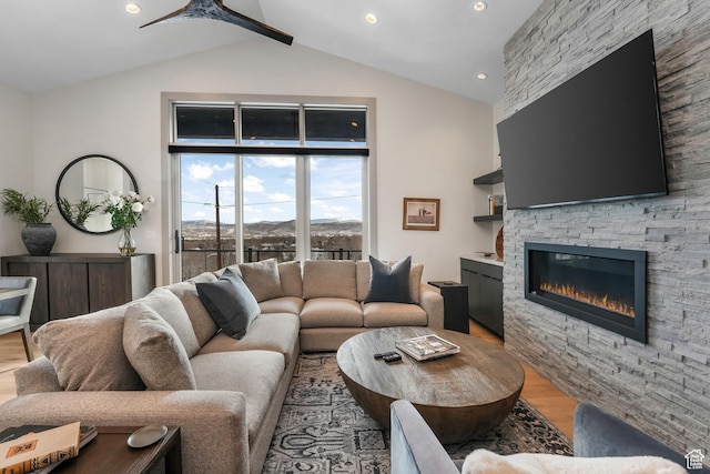 4371 Frost Haven Rd, Park City, UT 84098 - living area with a ceiling fan, beamed ceiling, wood finished floors, a stone fireplace, and high vaulted ceiling