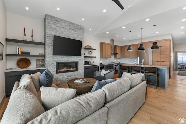 4371 Frost Haven Rd, Park City, UT 84098 - living area featuring light wood finished floors, a fireplace, high vaulted ceiling, and recessed lighting
