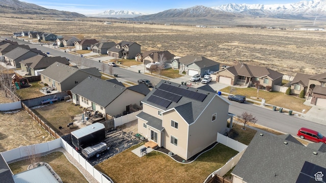 birds eye view of property with a mountain view and a residential view